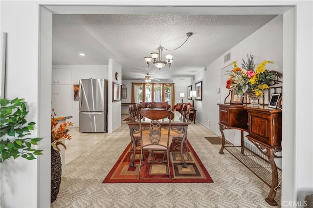 621 Shasta Way, Hemet, CA 92543 - dining area featuring a chandelier, a textured ceiling, recessed lighting, and light carpet
