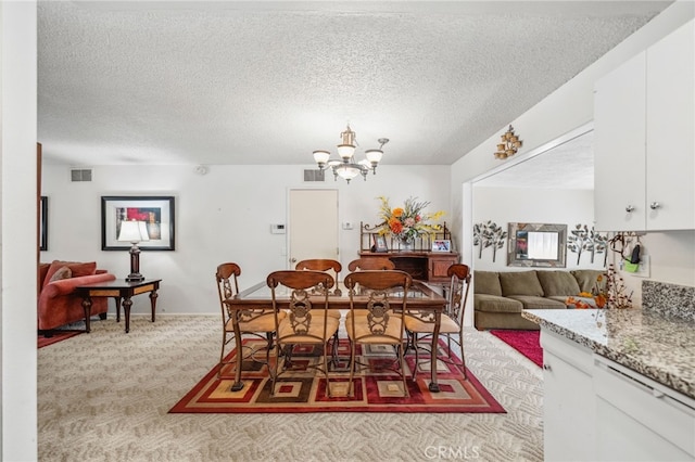 621 Shasta Way, Hemet, CA 92543 - dining area with a chandelier, light colored carpet, and a textured ceiling