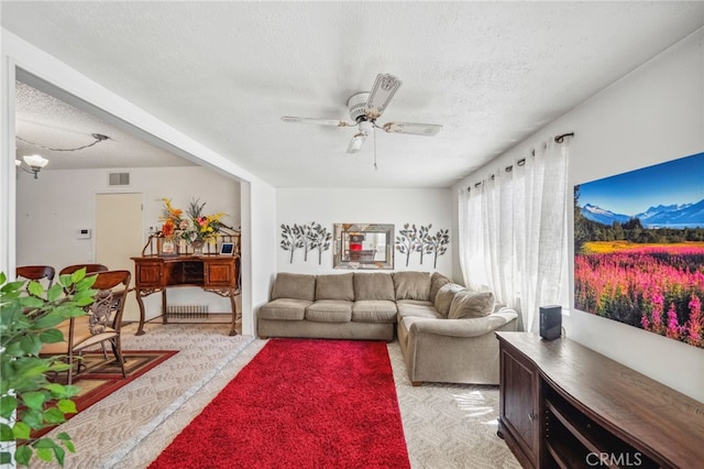 621 Shasta Way, Hemet, CA 92543 - living room featuring a textured ceiling, ceiling fan, and light colored carpet