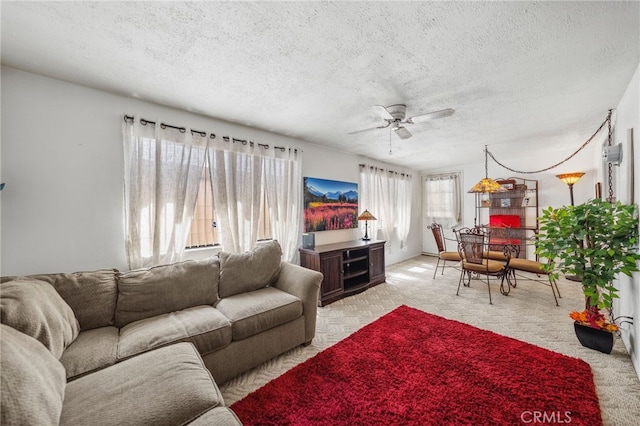 621 Shasta Way, Hemet, CA 92543 - living area with a textured ceiling, ceiling fan, and light carpet