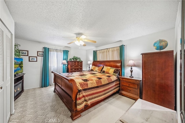 621 Shasta Way, Hemet, CA 92543 - bedroom with light carpet, ceiling fan, and a textured ceiling