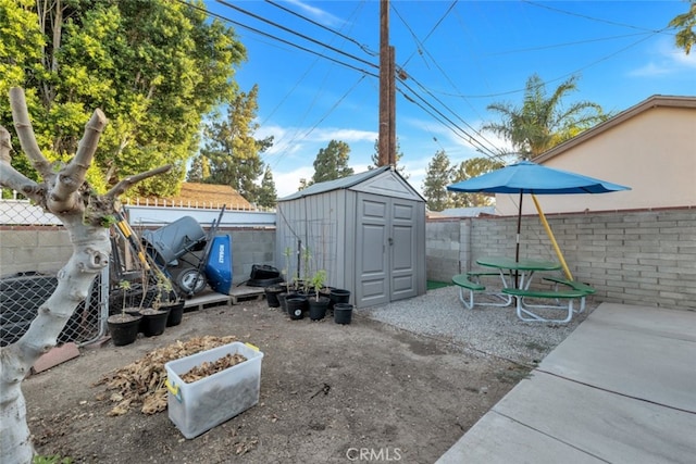 16908 Los Alimos St, Granada Hills, CA 91344 - fenced backyard featuring a storage unit and a patio area