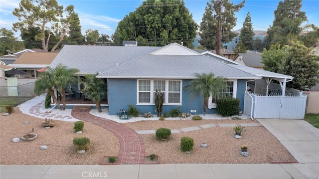 16908 Los Alimos St, Granada Hills, CA 91344 - view of front of house with a gate, roof with shingles, and stucco siding