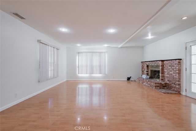 16908 Los Alimos St, Granada Hills, CA 91344 - unfurnished living room featuring light wood finished floors, a brick fireplace, and recessed lighting