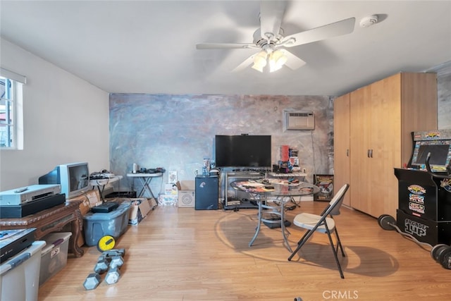 16908 Los Alimos St, Granada Hills, CA 91344 - office space with an accent wall, a wall unit AC, a ceiling fan, and wood finished floors