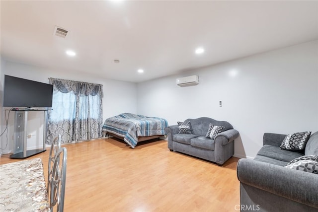 16908 Los Alimos St, Granada Hills, CA 91344 - bedroom with a wall mounted AC, light wood-style flooring, and recessed lighting