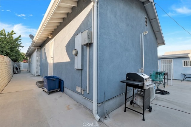 16908 Los Alimos St, Granada Hills, CA 91344 - view of side of home with a patio and stucco siding