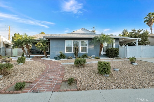 16908 Los Alimos St, Granada Hills, CA 91344 - ranch-style home with a gate, stucco siding, a carport, and concrete driveway