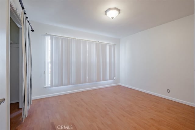 16908 Los Alimos St, Granada Hills, CA 91344 - unfurnished bedroom with wood finished floors and baseboards