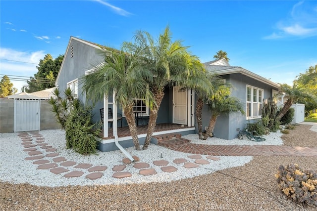 16908 Los Alimos St, Granada Hills, CA 91344 - view of front of property featuring a gate, stucco siding, and a porch