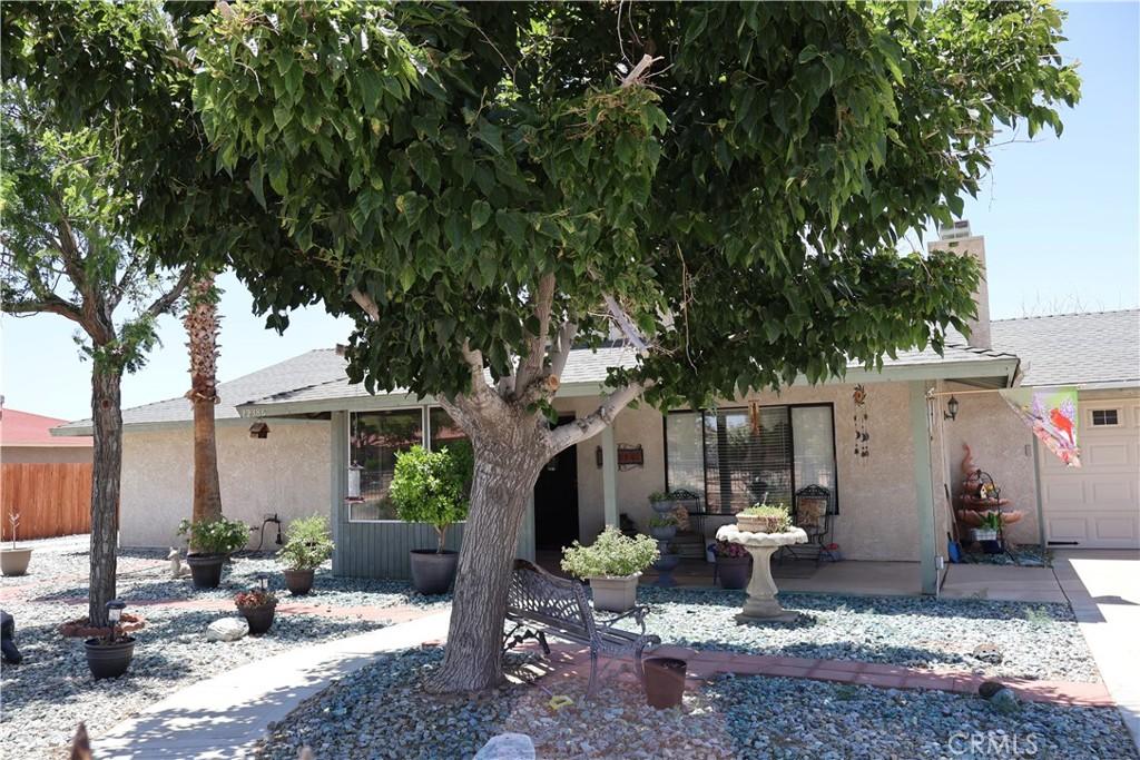 12386 Pawnee Rd, Apple Valley, CA 92308 - view of front of house with stucco siding and an attached garage