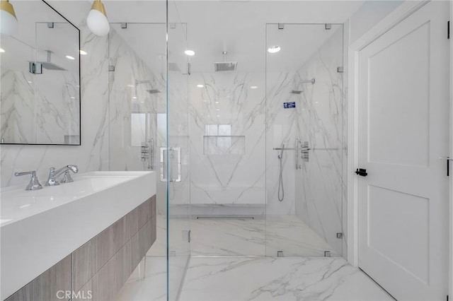 20500 Blairmoore St, Chatsworth, CA 91311 - full bath with a marble finish shower, vanity, and marble finish flooring