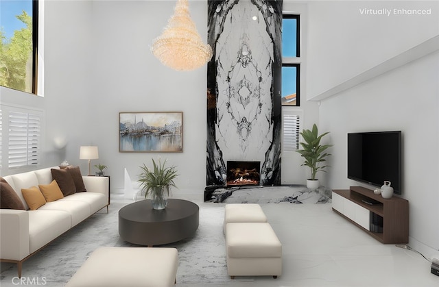 20500 Blairmoore St, Chatsworth, CA 91311 - living area featuring a towering ceiling, plenty of natural light, and a fireplace