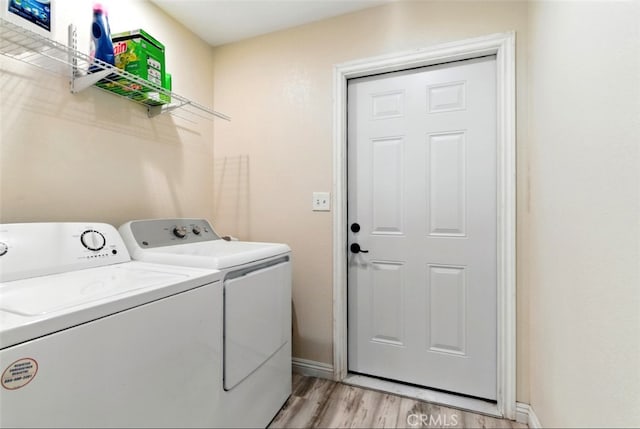 29246 Radio Rd, Barstow, CA 92311 - laundry room featuring washer and dryer and light wood-type flooring