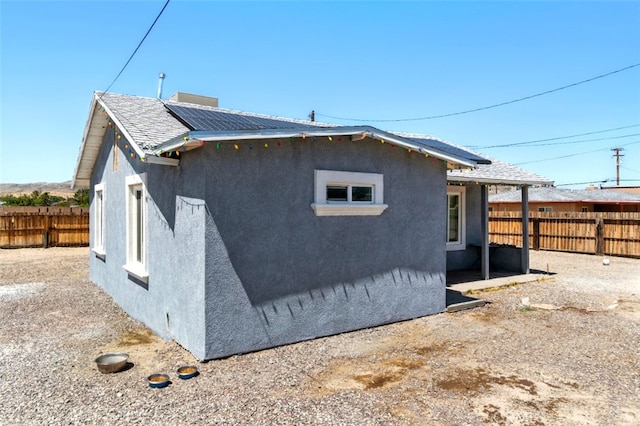 29246 Radio Rd, Barstow, CA 92311 - view of side of property featuring stucco siding and a fenced backyard