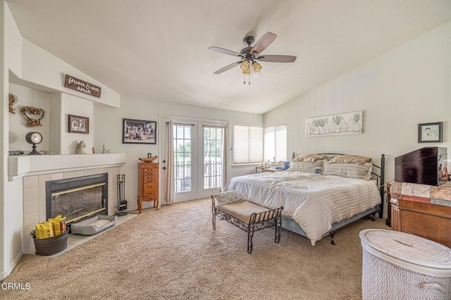 4665 Northridge Dr, Palmdale, CA 93551 - bedroom with vaulted ceiling, access to outside, carpet flooring, a fireplace, and ceiling fan