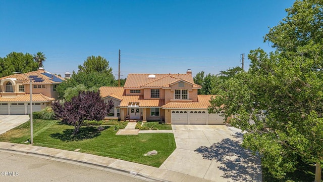 4665 Northridge Dr, Palmdale, CA 93551 - mediterranean / spanish-style home featuring a tile roof, concrete driveway, stucco siding, a chimney, and a front lawn