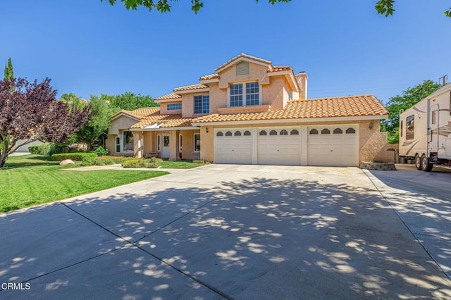 4665 Northridge Dr, Palmdale, CA 93551 - mediterranean / spanish-style home with stucco siding, a garage, concrete driveway, and a front yard