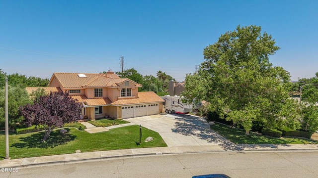 4665 Northridge Dr, Palmdale, CA 93551 - view of front of house with a tiled roof, driveway, stucco siding, a chimney, and a front yard