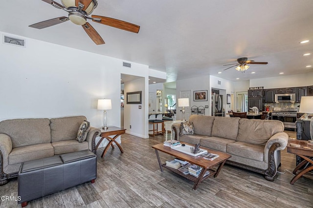 4665 Northridge Dr, Palmdale, CA 93551 - living room featuring a ceiling fan, wood finished floors, and recessed lighting