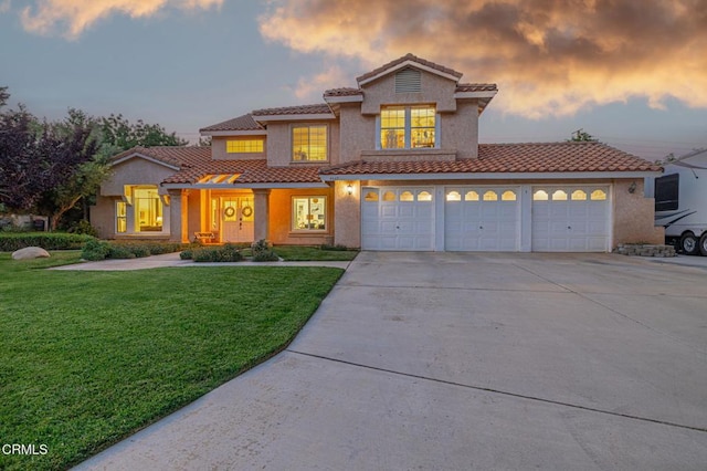 4665 Northridge Dr, Palmdale, CA 93551 - mediterranean / spanish house with a tiled roof, driveway, a yard, stucco siding, and an attached garage