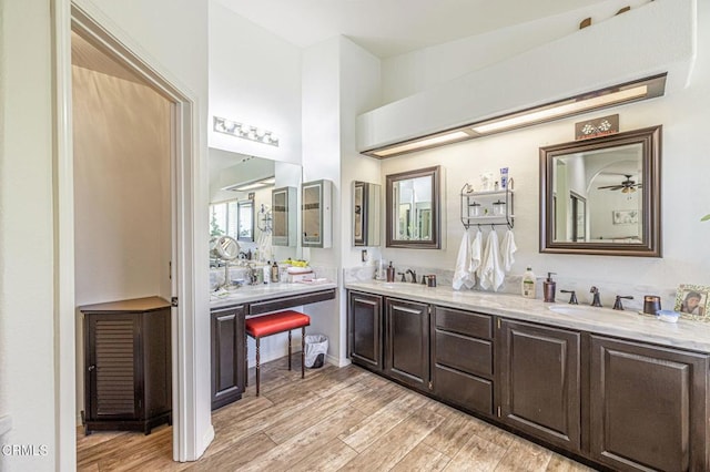 4665 Northridge Dr, Palmdale, CA 93551 - bathroom featuring double vanity and wood finished floors