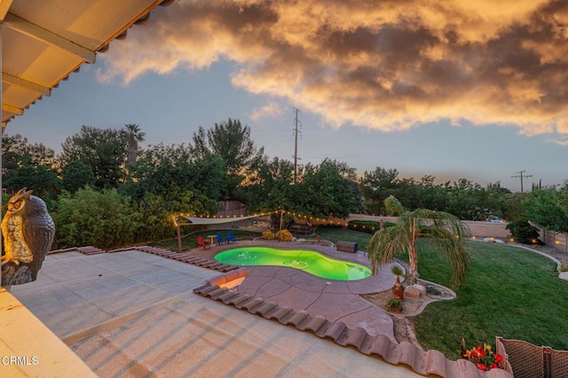 4665 Northridge Dr, Palmdale, CA 93551 - pool at dusk featuring a patio, a yard, and an outdoor pool