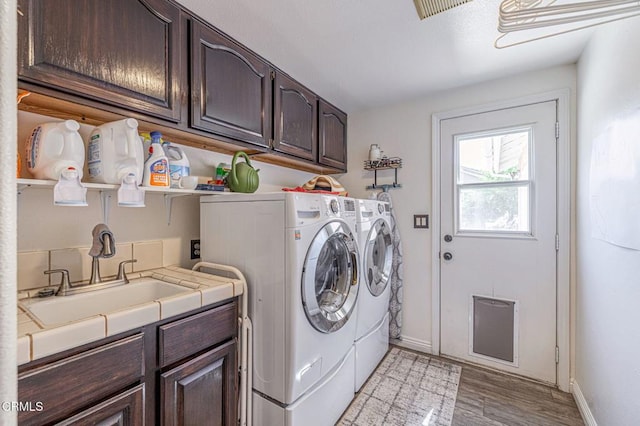 4665 Northridge Dr, Palmdale, CA 93551 - laundry area featuring cabinet space, independent washer and dryer, and light wood finished floors