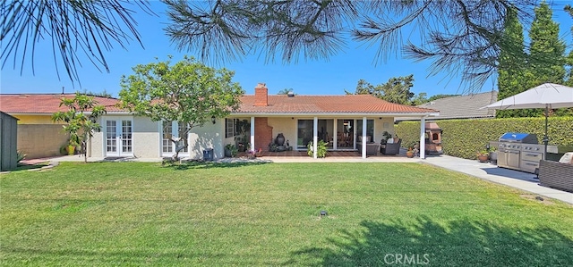 25532 Maximus St, Mission Viejo, CA 92675 - rear view of house featuring a chimney, french doors, a patio, exterior kitchen, and stucco siding