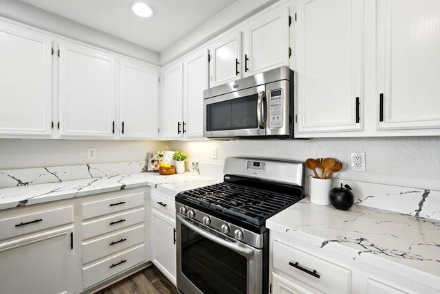 1250 Pinnacle Peak, Chula Vista, CA 91915 - kitchen with stainless steel appliances, white cabinetry, light stone counters, and recessed lighting