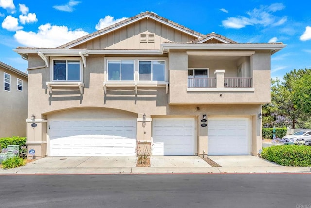 1250 Pinnacle Peak, Chula Vista, CA 91915 - view of front facade featuring stucco siding, a tile roof, an attached garage, and a balcony
