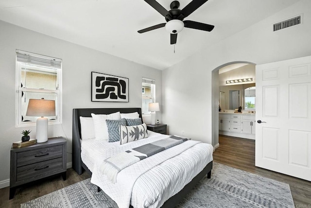 1250 Pinnacle Peak, Chula Vista, CA 91915 - bedroom featuring arched walkways, multiple windows, dark wood-type flooring, ensuite bathroom, and lofted ceiling