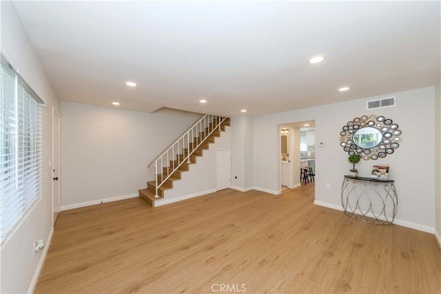 918 Huntington Dr Unit O, Duarte, CA 91010 - unfurnished living room with stairs, light wood-style floors, and recessed lighting
