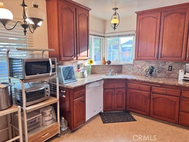 15945 Lashburn St, Whittier, CA 90603 - kitchen featuring dishwasher, stainless steel microwave, decorative backsplash, and a chandelier