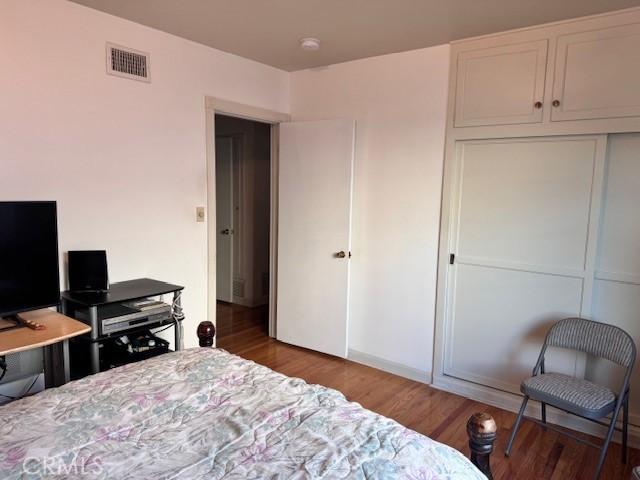 15945 Lashburn St, Whittier, CA 90603 - bedroom with wood finished floors and a closet