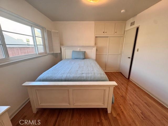 15945 Lashburn St, Whittier, CA 90603 - bedroom featuring wood finished floors and a closet