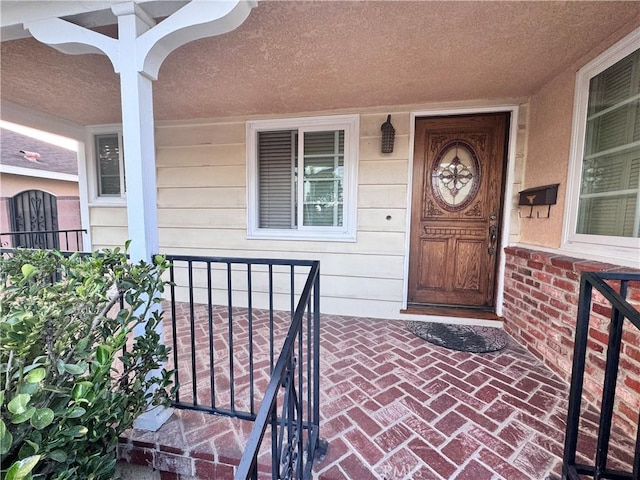 15945 Lashburn St, Whittier, CA 90603 - property entrance featuring a porch and brick siding