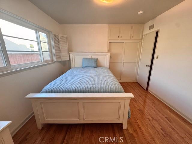 15945 Lashburn St, Whittier, CA 90603 - bedroom featuring wood finished floors and a closet