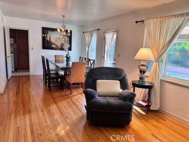 15945 Lashburn St, Whittier, CA 90603 - dining room featuring a chandelier, healthy amount of natural light, and light wood finished floors