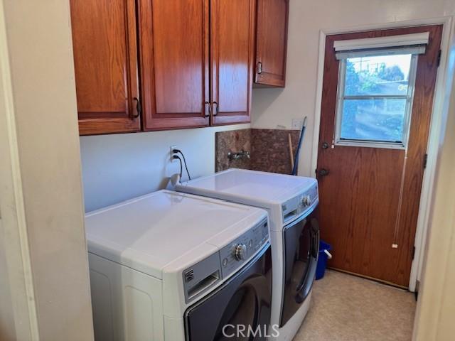 15945 Lashburn St, Whittier, CA 90603 - washroom featuring cabinet space, separate washer and dryer, and light floors