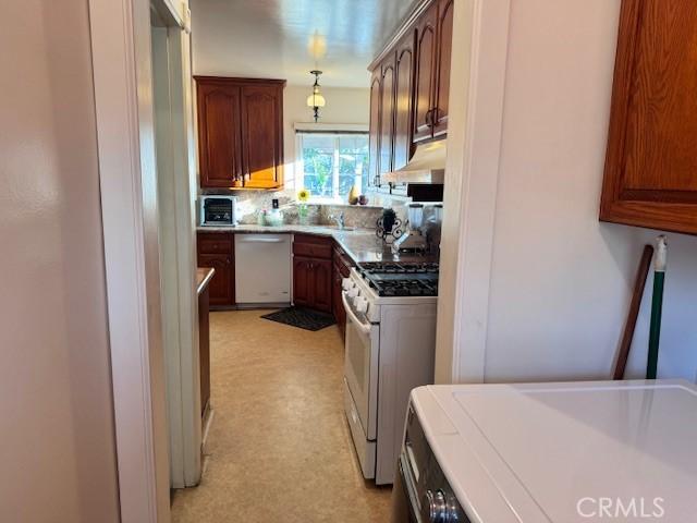 15945 Lashburn St, Whittier, CA 90603 - kitchen with white appliances, extractor fan, and light floors