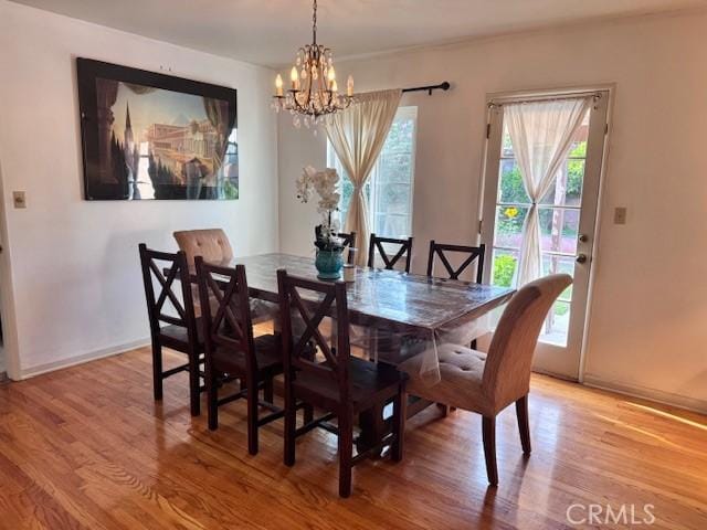 15945 Lashburn St, Whittier, CA 90603 - dining room with a chandelier and light wood-type flooring