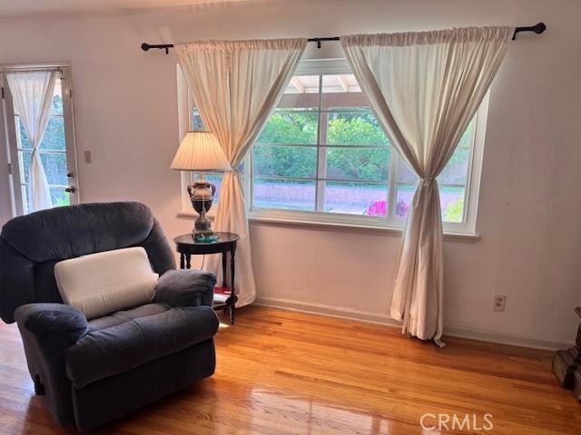 15945 Lashburn St, Whittier, CA 90603 - living area with light wood-type flooring and baseboards