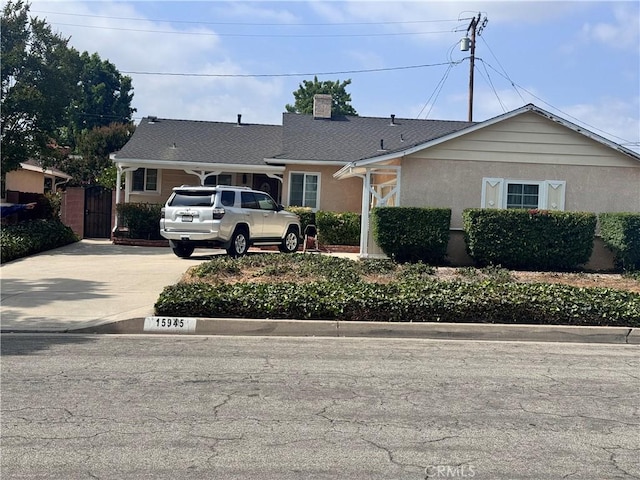 15945 Lashburn St, Whittier, CA 90603 - view of front of property featuring a chimney, a gate, stucco siding, and concrete driveway