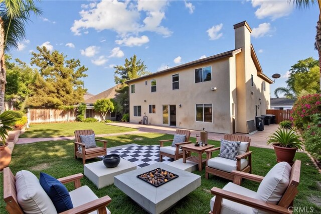 31772 Ridgeview Dr, Lake Elsinore, CA 92532 - rear view of house featuring an outdoor living space with a fire pit, a patio area, and stucco siding