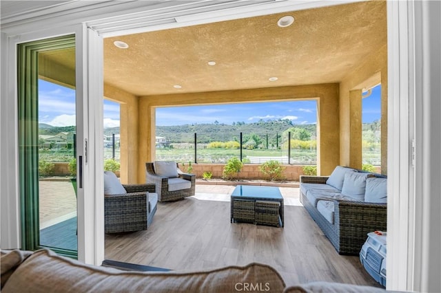 33303 Barmetta Ln, Temecula, CA 92592 - living room featuring wood finished floors, recessed lighting, and healthy amount of natural light