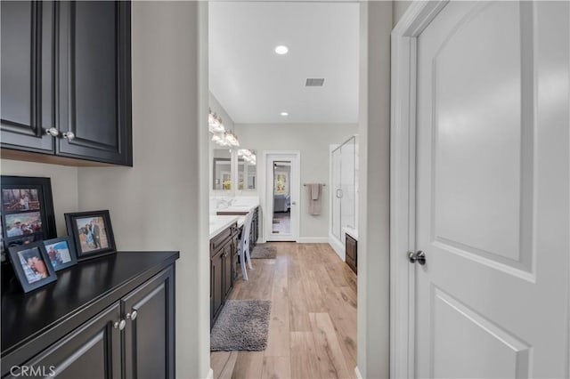 33303 Barmetta Ln, Temecula, CA 92592 - corridor featuring light wood finished floors and recessed lighting