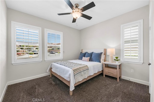 33303 Barmetta Ln, Temecula, CA 92592 - bedroom featuring multiple windows, dark colored carpet, and a ceiling fan