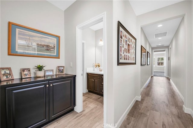 33303 Barmetta Ln, Temecula, CA 92592 - corridor featuring light wood-type flooring and recessed lighting