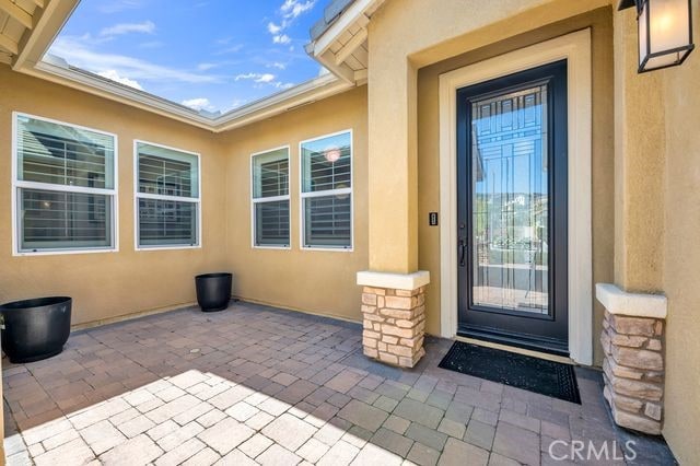 33303 Barmetta Ln, Temecula, CA 92592 - entrance to property featuring stucco siding and a patio